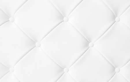 Light white luxury upholstery sofa texture background concept for clean gray vintage leather furniture pattern wallpaper, closeup interior elegant armchair mattress surface detail, real tuft material.の写真素材