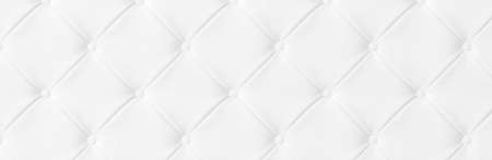 Wide Light white luxury upholstery sofa texture background concept for clean gray vintage leather furniture pattern wallpaper, closeup interior elegant armchair mattress surface detail, real material.の写真素材