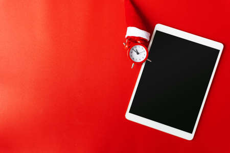 Creative flat lay vintage clock on red office table top view background concept alarm clock on red paper color with copy space in minimal style, empty template for text, break workplace at noon for lunch, back to school.の写真素材
