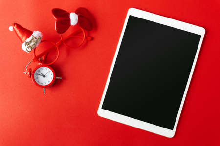 Creative flat lay vintage clock on red office table top view background concept alarm clock on red paper color with copy space in minimal style, empty template for text, break workplace at noon for lunch, back to school.の写真素材