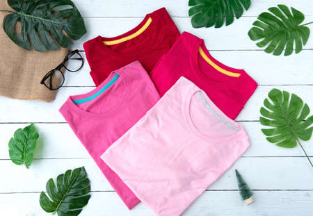 Retro fold Pink cotton T-Shirt clothes colorful mock up template on grunge white wood background concept for retail dress shop backdrop, Blank flat lay vintage grey wooden plain laundry advertising, Love couple designの写真素材