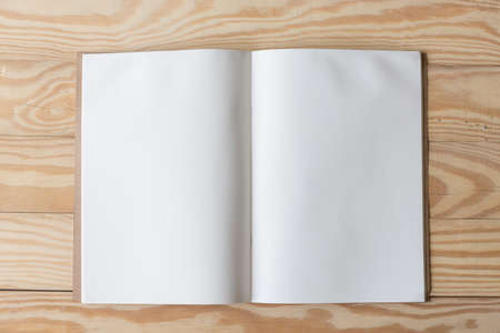 Abstract Blank one white paper on wooden table top view background concept for empty letter business sheet, plain brochure mock up template, flyer card, notebook frame notepad.の写真素材