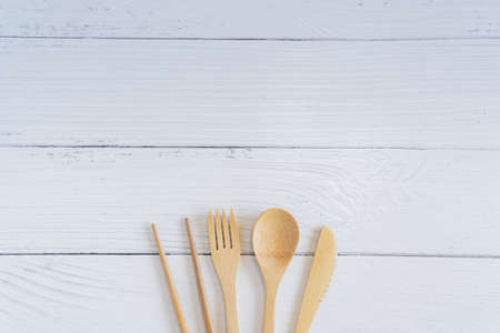 Bamboo wood toothbrush on clean white marble table top view background concept for save the earth day, world environmental, plastic free, kitchen flat lay lifestyle, bathroom reusable wood product.の写真素材