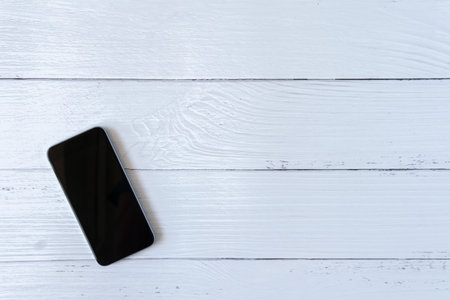 Vintage Phone mockup flat lay on old table top white wood background texture space concept workspace office blank note, plan on calendar new year 2019, business blogger idea empty wooden viewの写真素材