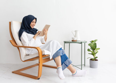 Young Muslim women Students is a creative freelance journalist sit writing to be entrepreneur job...