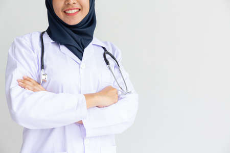 Young Arab Muslim intern doctor women smile on isolate white background concept for Islam people working in medical hospital health care, Modern Nurse wearing hijab in medico clinic business service.の写真素材