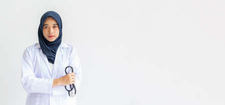 Young Arab Muslim intern doctor women smile on isolate white background concept for Islam people working in medical hospital health care, Modern Nurse wearing hijab in medico clinic business service.の写真素材