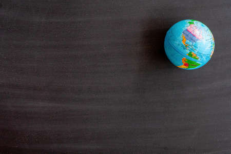 World map on Blank front Real black chalkboard background texture in college concept for back to school kid wallpaper for create white chalk text draw graphic. Empty old back wall education blackboard.の写真素材