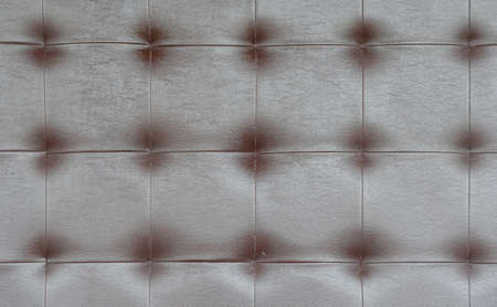 Light black luxury upholstery sofa texture background concept for clean gray vintage leather furniture pattern wallpaper, closeup interior elegant armchair mattress surface detail, real tuft material.の写真素材