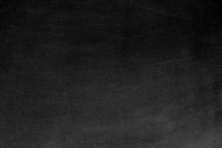 Blank front Real black chalkboard background texture in college concept for back to school kid wallpaper for create white chalk text draw graphic. Empty old back wall education blackboard.の写真素材