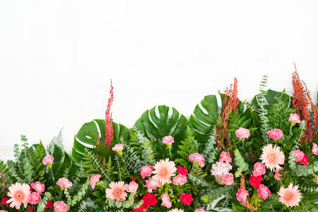 Tropical leaves and flower foliage plant bush floral arrangement nature isolated on white background, clipping path included.の写真素材