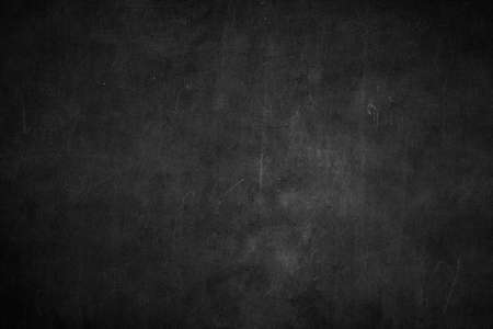Blank front Real black chalkboard background texture in college concept for back to school kid wallpaper for create white chalk text draw graphic. Empty old back wall education blackboard.の写真素材