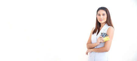 Happy woman smile at credit card, hold shopping reward bonus on panoramic isolate white background. Wide Student customer people show debit reward for discount payment, loan dept purchase conceptの写真素材
