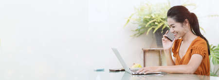Young student woman use wireless internet learning and co-working at home on mobile tablet app. Modern girl people blogger couch on laptop education classroom online device, Social distancing in spaceの写真素材
