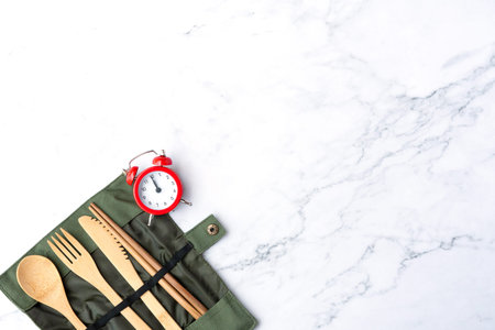 50sÂ vintage red clock on luxury marble textured background office table top view studio shot concept alarm breaking workplace at noon for lunch, learning school space, count down 2020 to 2021の写真素材