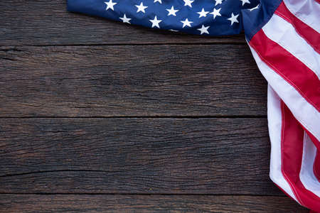 America flag waving pattern on wooden background in table top view, red blue white strip concept for USA 4th july independence day, symbol of patriot freedom and democracy. Glory pride in memorial day of libertyの写真素材