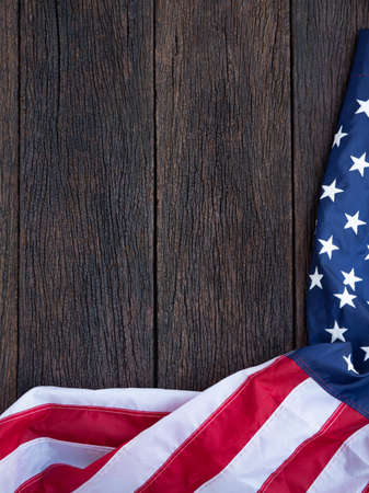 America flag waving pattern on wooden background in table top view, red blue white strip concept for USA 4th july independence day, symbol of patriot freedom and democracy. Glory pride in memorial day of libertyの写真素材