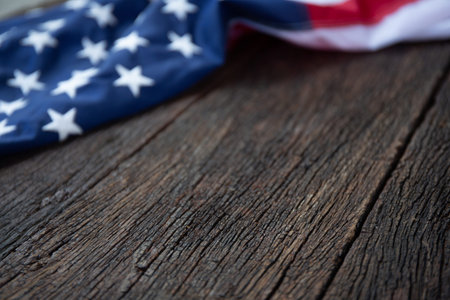 America flag waving pattern on wooden background in table top view, red blue white strip concept for...