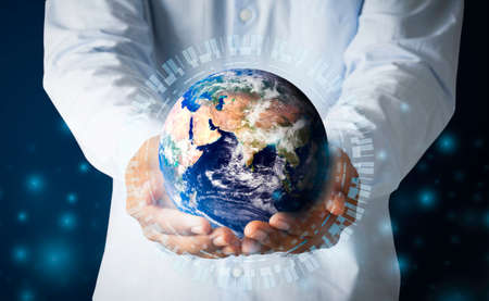 Businessman hand holding multinational hologram globe concept for world map responsibility, cloud internet network connection, international tech information, global education classroom online, CSR earth ecosystemの写真素材