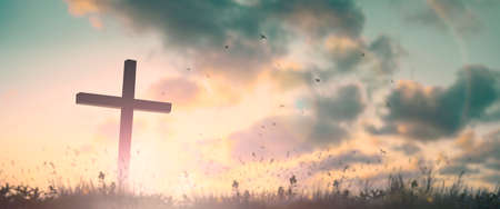 Silhouette jesus christ crucifix on cross on calvary sunset background concept for good friday he is risen in easter day, good friday jesus death on crucifix, world christian and holy spirit religious.の写真素材