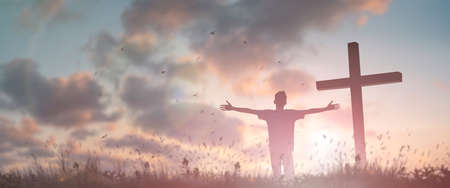 Happy man rise hand Worship God in morning view. Christian spirit prayer praise on good friday background. Male self confidence empowerment on mission arm concept strength wisdom ambitiousの写真素材