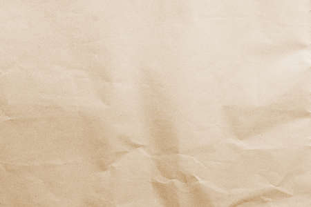 Plain brown eco paper texture in scrap canvas beige backdrop photo concept for letter craft design package box background. Pattern back of smooth parchment rice recycle surface and earth toneの写真素材