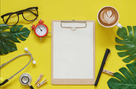 Vintage red clock in coffee time on hospital science office table top view concept blank empty workspace mockup display, Doctor stay and work at home for business ideaの写真素材