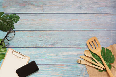 Kitchen tool in vlog filmmaker wooden table top view concept blank empty workspace mockup display, flat lay vlog stay and work at home for movie clip ideaの写真素材
