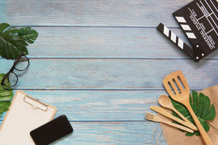 Kitchen tool in vlog filmmaker wooden table top view concept blank empty workspace mockup display, flat lay vlog stay and work at home for movie clip ideaの写真素材