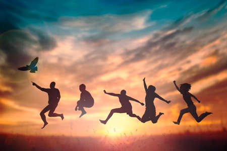 Happy family people group celebrate jump for good life on weekend concept for win victory, person faith in financial freedom healthy wellness, Great insurance team support retreat together in summer.の写真素材