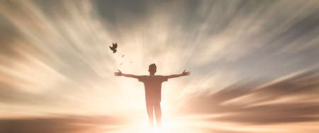 Silhouette woman with hands rise up on beautiful view. Christian praise on hill thanksgiving day background. support nature standing open arms enjoying sun concept jesus fun world wisdom 2021の写真素材