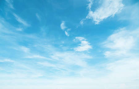 Summer Blue Sky and white clouds background. Beautiful clear cloudy in sunlight spring season. Panorama vivid cyan cloudscape in nature environment. Outdoor horizon skyline with spring sunshine.の写真素材