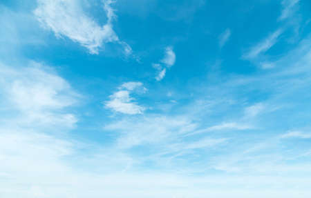 Summer Blue Sky and white clouds background. Beautiful clear cloudy in sunlight spring season. Panorama vivid cyan cloudscape in nature environment. Outdoor horizon skyline with spring sunshine.の写真素材