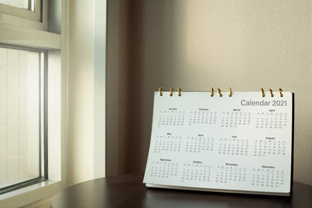 Desk calendar diary on hotel office table with year 2021 work place. Planning scheduling agenda, Event, organizer of plan 2020 to 2022. appointment, organization, management each date, month conceptの写真素材