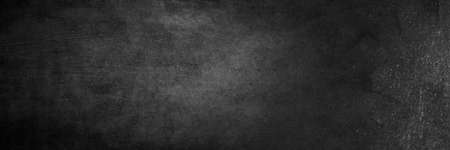 Blank wide screen Real chalkboard background texture in college concept for back to school panoramic wallpaper for black friday white chalk text draw graphic. Empty surreal room wall blackboard pale.の写真素材