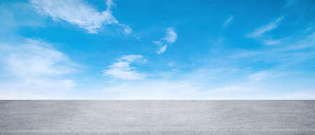 Panoramic empty grunge cement counter table top on blue sky white light bokeh background for product morning scene spring display montage, Abstract Blurry wide concrete desk in kitchen resort hotel.