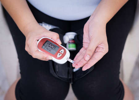 Pregnant woman checkup blood control risk sugar level for gestational. Female pregnancy health glucose measurement meter concept for glucometer, medicine, glycemia, health care. World Diabetes day.の写真素材