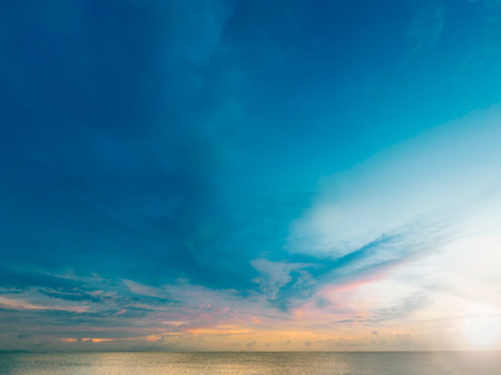 Summer Blue Sky and white clouds background. Beautiful clear cloudy in sunlight sunset season. Panorama vivid pink cloudscape in nature environment. Outdoor horizon skyline with spring sunshine.の写真素材