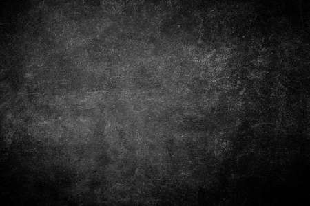 Real smudge black chalkboard texture in classroom school college concept kid dust map blackboard background for write front blank chalk board. Slate for student paint grunge old wall photography backの写真素材