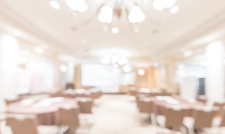 beautifully arranged conference room featuring neatly placed tables and chairs, ready for a professional event, with attention to decor and organization, fostering engagement and collaborationの写真素材