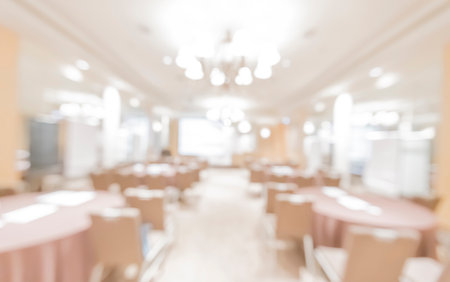 beautifully arranged conference room featuring neatly placed tables and chairs, ready for a professional event, with attention to decor and organization, fostering engagement and collaborationの写真素材