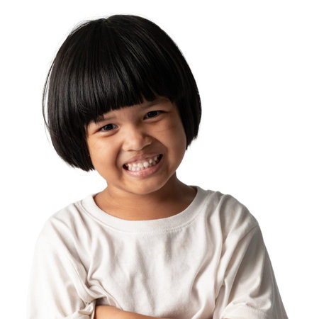 ADHD child girl short hair white t-shirt showing happy cute smile, young kid adorable cheerful...