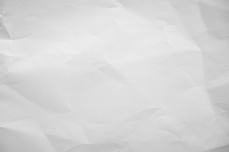 Crumpled paper texture crease natural background authenticity imperfection white sheet smooth matte paper unmarked symbolizing purity minimalism plain surface Paper art highlights organic fibers grainの写真素材