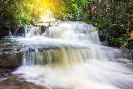 Mun Dang Waterfall in deep forest fresh green rain season in Thailandの写真素材