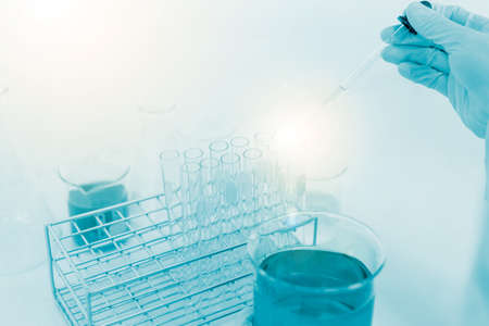 scientist hand holding laboratory test tube, science laboratory research and development conceptの写真素材