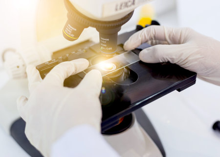 scientist hand holding laboratory test tube, science laboratory research and development concept
