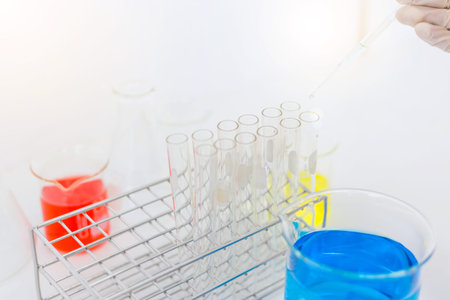 scientist hand holding laboratory test tube, science laboratory research and development concept