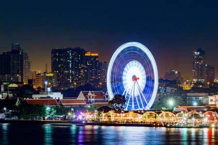 Bangkok, Thailand - Aerial view Bangkok city night view Modern building condominium temple Asiatique Teh Riverfron ,Asiatique ferris Wheel near River in town ,Thailandの写真素材