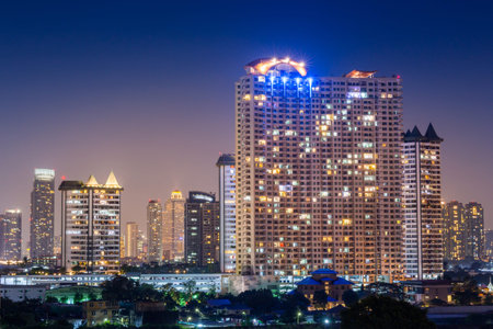 Night architecture Business office building and  Modern complex of apartment buildings  Bangkok , Thailandの写真素材