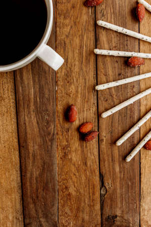 delicious nuts and almond sticks with a delicious cup of coffee without milkの写真素材